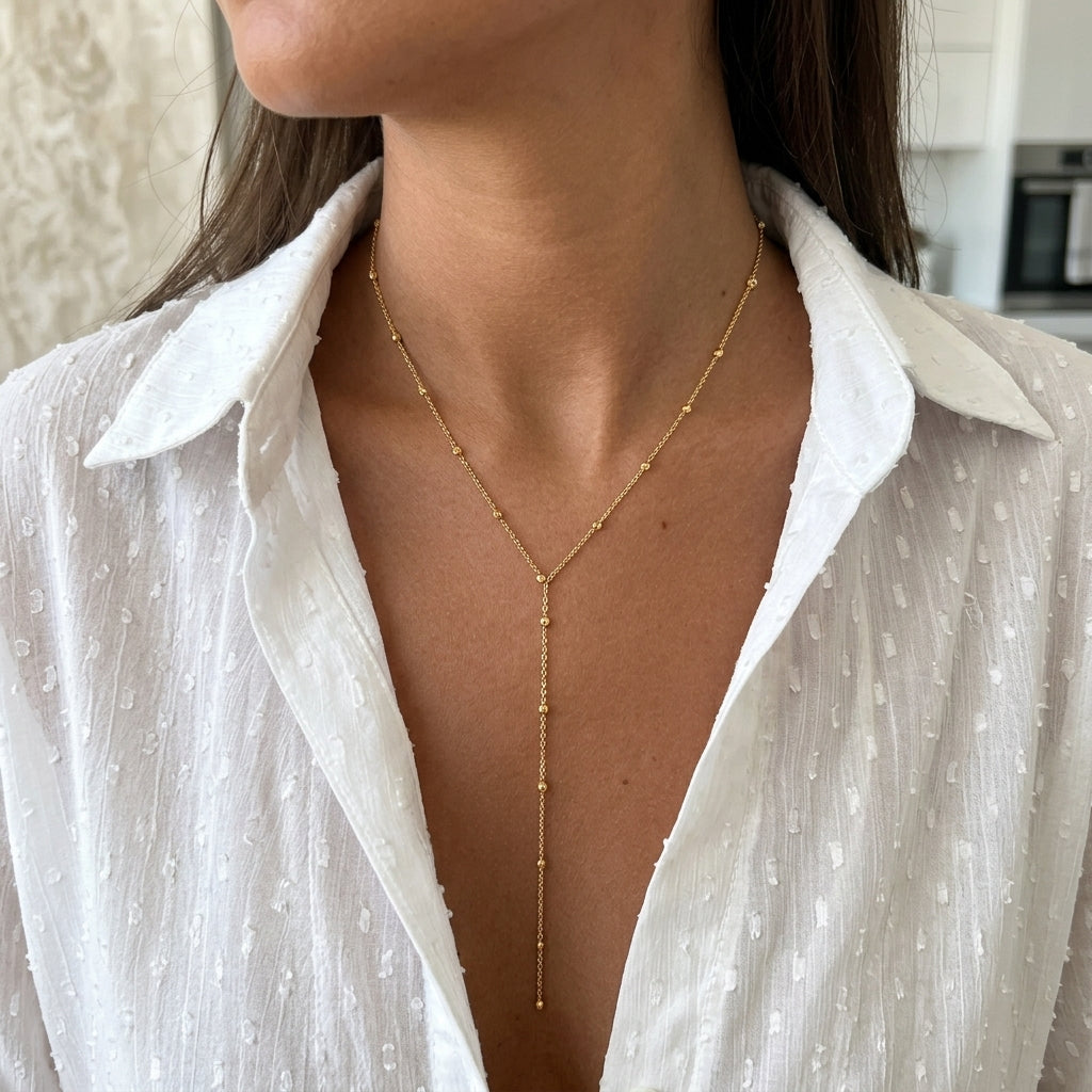 Nora gold necklace detail on model