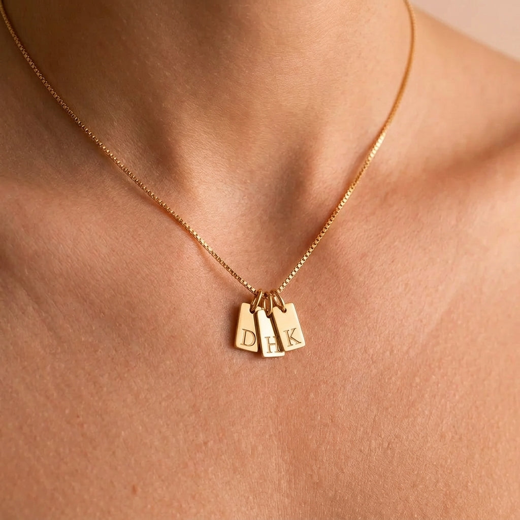 Ivy initial necklace on the collarbone