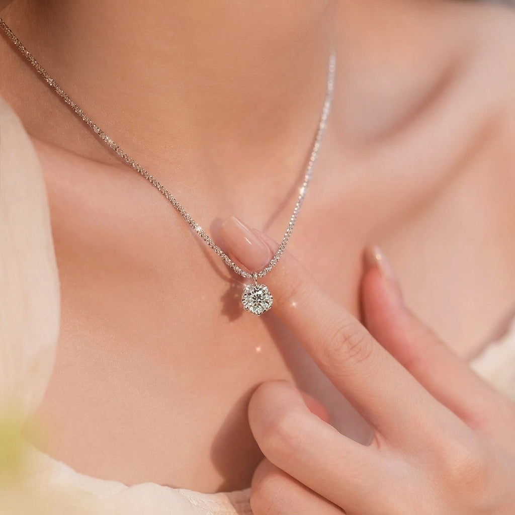 Woman touching Vera necklace pendant